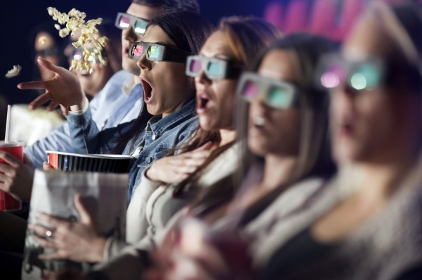 Audience Watching Movie with 3-d glasses.